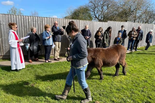 Hugo on his way to the Palm Sunday Service in Bilsthorpe watched by the parishioners