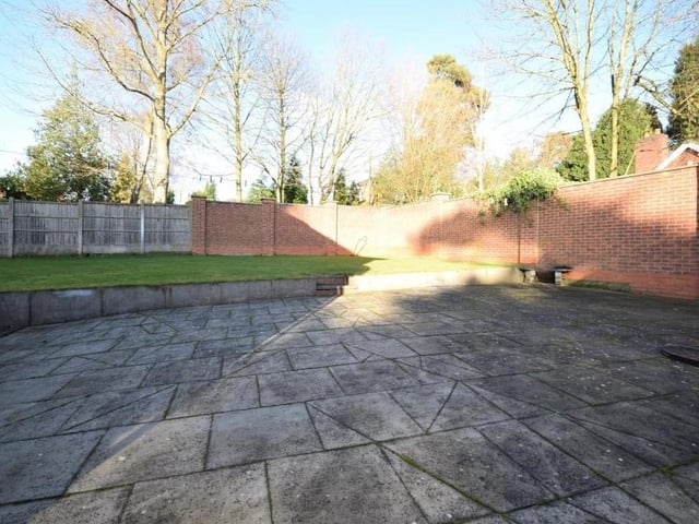 As we say farewell to the £895,000 property in Ravenshead, let's nip back outside to take a look at this sizeable, paved patio area. Lovely for relaxing on a warm summer's day or even hosting barbecues for family and friends.