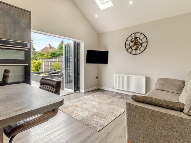 This is the cosy living section of the open-plan kitchen, complete with views of, and access to, the rear garden.
