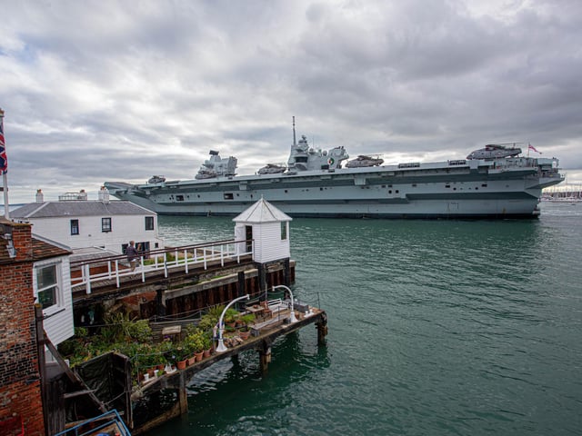 Pictured: HMS QE as it passes The Point, Old Portsmouth. View from Sill & West pub. Picture: Habibur Rahman
