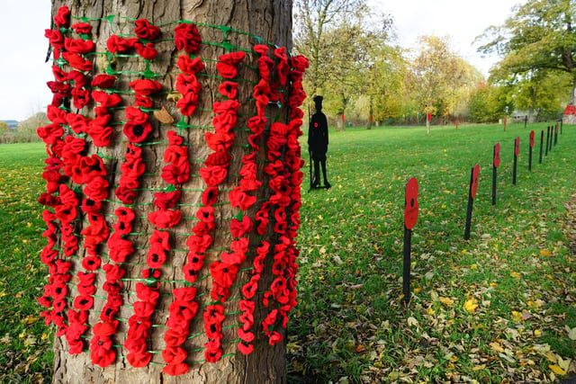 Handmade poppies on the trees.