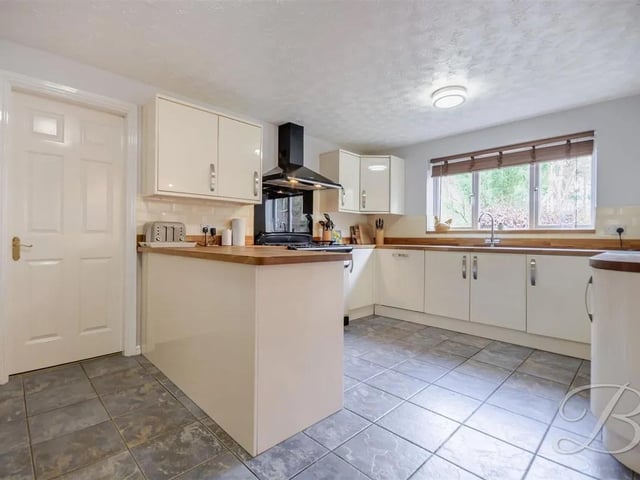 The bright and light modern kitchen is well-equipped with everything needed for day-to-day living.