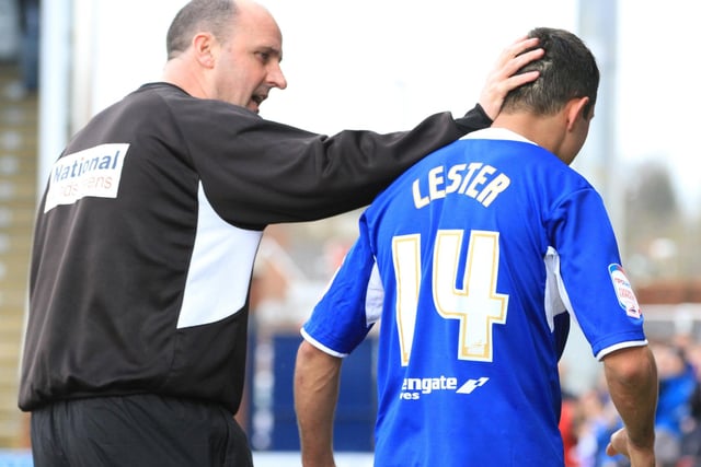 Manager Paul Cook  greets Jack Lester off the pitch one final time in a home game against Exeter City.