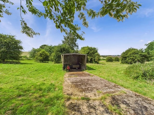 The lush greenery provides endless opportunities for outdoor activities, equestrian pursuits, or simply a serene backdrop to enjoy the natural beauty of the surroundings.