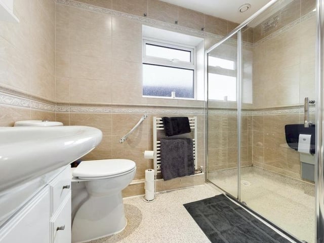 Close to the two bedrooms at the £240,000 bungalow is this tasteful shower room. A three-piece suite consists of a shower cubicle, wash hand basin and low-flush WC