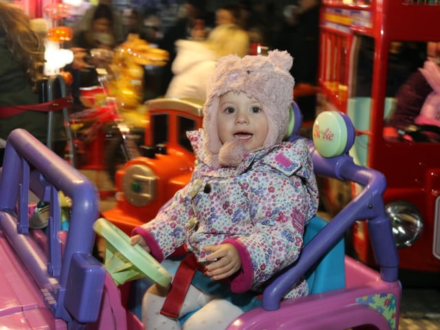 Amelie Musson enjoys the roundabout ride in 2017.