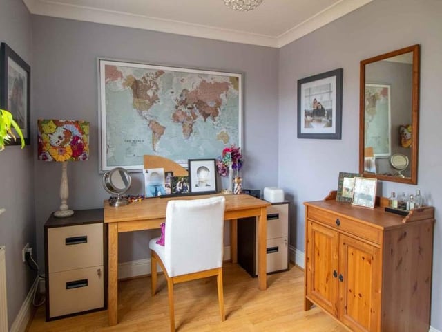 The fourth double bedroom at the Willowbridge Lane property is currently being used as a dressing room. It has a built-in wardrobe.