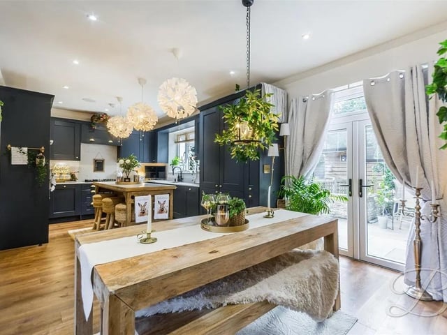 The dining area has ample space for furnishings. There are patio doors leading to the rear garden and opening up to the living room creating a lovely social space.
