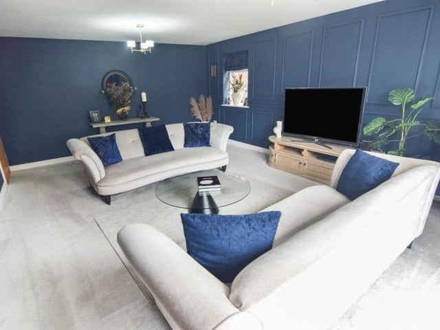 Like all rooms on the ground floor of the property, the striking lounge benefits from underfloor heating.