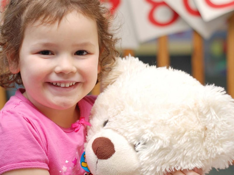 Daisy Wilson enjoys a teddy bear's picnic at the Carousel under 5's pre-school nursery in Sutton in 2009.