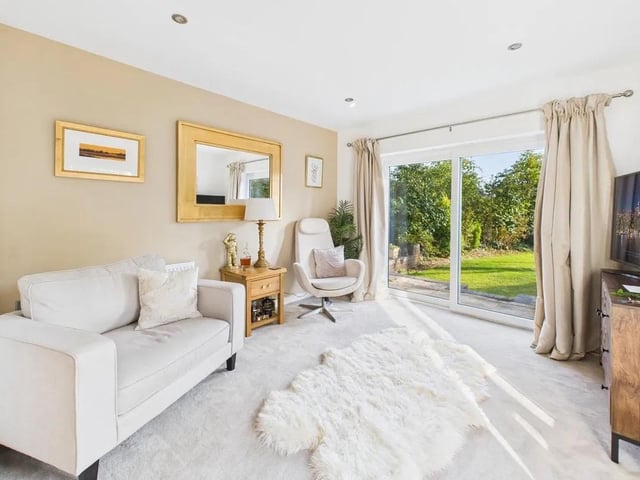 A relaxing and spacious additional reception room currently being used as a sitting room and ground-floor fourth bedroom with feature patio doors overlooking the rear patio and garden.