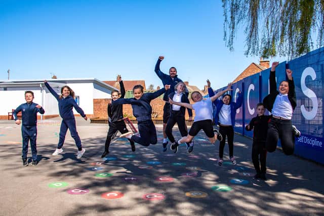 PE specialist Tom Darby with Mapplewells Primary & Nursery School pupils. Photo: Louise Brimble