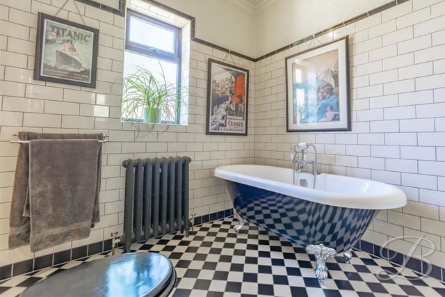 Even the bathroom maintains the traditional theme found throughout the bungalow. It comes complete with a roll-top bath, enclosed shower, high-level WC, storage cupboard, tiled walls and cast-iron radiator.