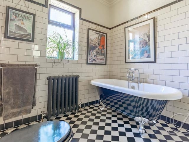 Even the bathroom maintains the traditional theme found throughout the bungalow. It comes complete with a roll-top bath, enclosed shower, high-level WC, storage cupboard, tiled walls and cast-iron radiator.