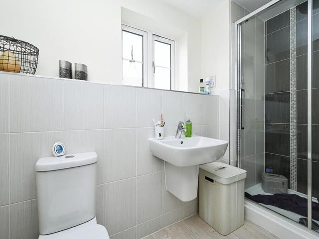 Here is the first of two fabulous en suites within the Adams Park Way house. It is fitted with a shower cubicle, wash hand basin and low-flush WC.