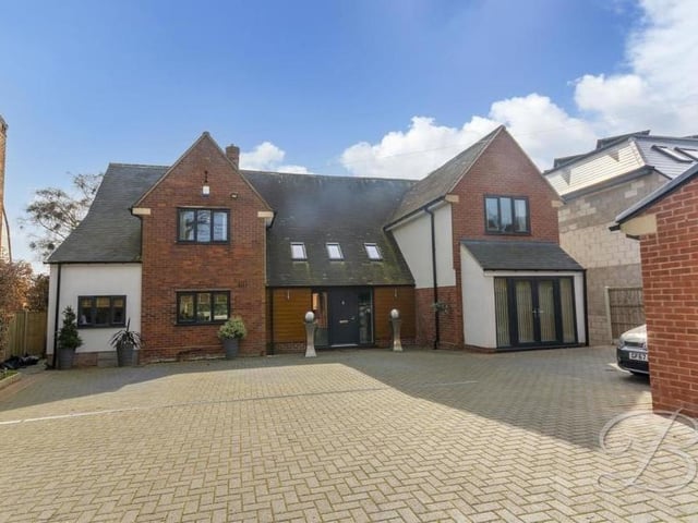 Back to the front of the property and its formidable frontage. The block-paved driveway is gated and provides plenty of room for off-street parking.