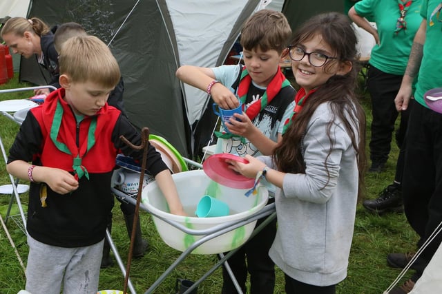 Washing up your pots is still an important part of camp routine, as demonstrated by these hardworking scouts.