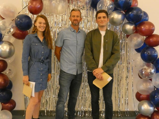 Emily Rosindell and Sam Valasek, Head Girl and Boy, with Chris Woollard, headteacher
