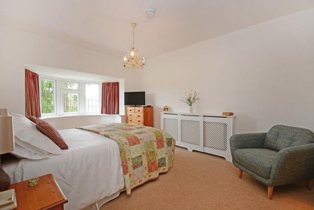The master bedroom has double doors leading to a dressing room with fitted wardrobes, as well as an en-suite wet room. Elsewhere in the house there are three further double bedroom and one single, which could be used as a study.