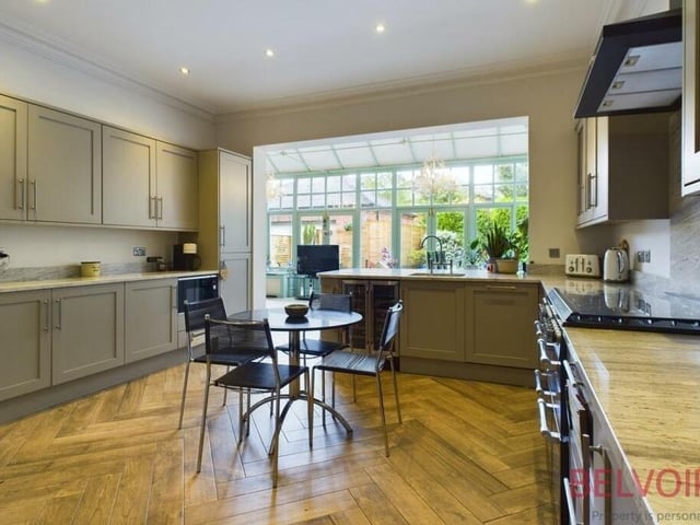 The first room we come to is this contemporary kitchen, which has been recently upgraded and is fitted with everything a family may need. A range of storage cupboards and larder units, granite worktops, a tiled herringbone floor and ceiling spotlights add real style, while there is ample space for a breakfast table