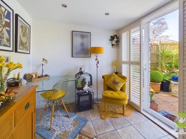 Next to the kitchen is this study, which provides a tranquil workspace and has the added benefit of French doors, which give access to the lovely garden.