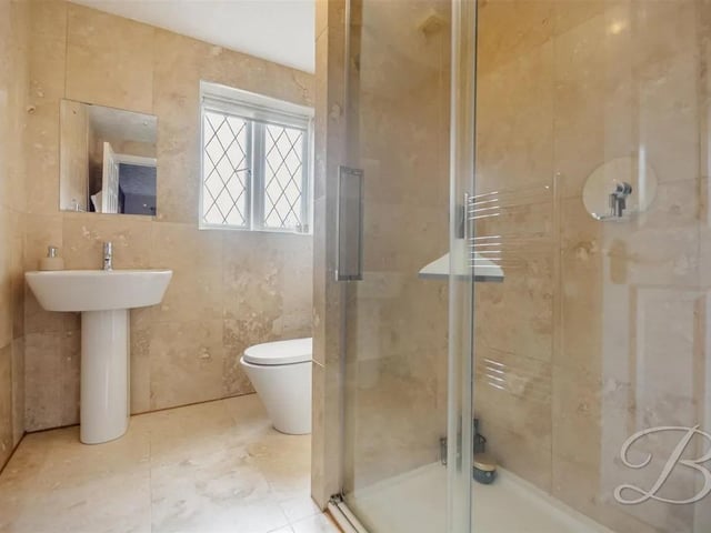 The luxurious master bedroom benefits from a private en suite, providing a peaceful retreat.
