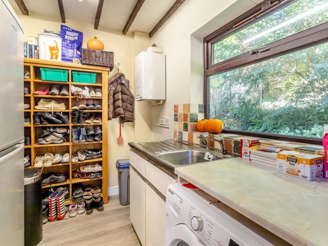 Just off the kitchen is this useful utility room, which has plumbing for a washing machine and space for both a fridge freezer and a tumble dryer. The room also houses a stainless steel sink with drainer and a wall-mounted, gas-fired central heating boiler.