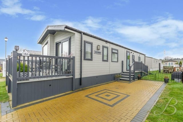 We say farewell to the £130,000 mobile home with a final shot of the exterior and a private driveway offering off-street parking space for the family car.
