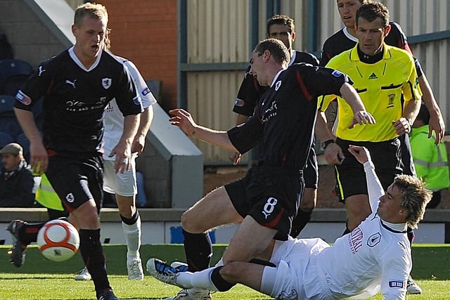 Mark Millar clatters Stephen Simmons during a September 2010 match which Raith won 2-1 at Stark's Park.