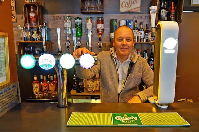 Owner Merv O'Connor behind the bar at the Oasis Lounge Bar.