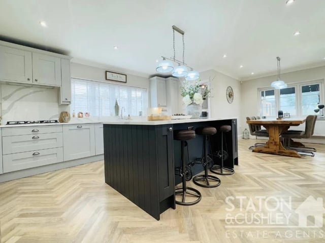 The kitchen has a range of fitted wall and base units, integrated double oven, hob, dishwasher, boiling water tap, bins and an inset Belfast style sink. The room is complemented with a great sized island and Quartz worktops as well as an array of beautiful lighting throughout.