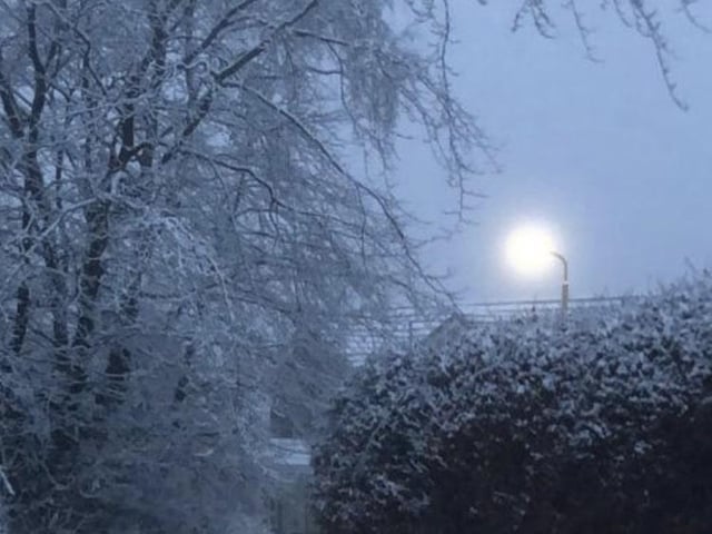 A haunting serene scene of a streelight shining prominently amongst a bay of whites and blues as Newton Mearns in East Renfrewshire was covered in a blanket of snow (Photo: Raymond Brown).