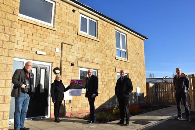 Pictured is (left to right) Councillor Steve Fritchley, Leader of Bolsover District Council, Councillor Sandra Peake, Cabinet Member for Housing of Bolsover District Council, David Pearson, Robert Woodhead Ltd and Councillor Duncan McGregor, Deputy Leader of Bolsover District Council and Grant Galloway, Director of Development of Bolsover District Council outside the new flats at The Paddock, Bolsover.