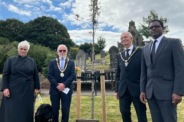 The tree dedication was attended by the Revd Cannon Barbara Hollbrook, Trevor Rood, David Grindell, and local MP Darren Henry.