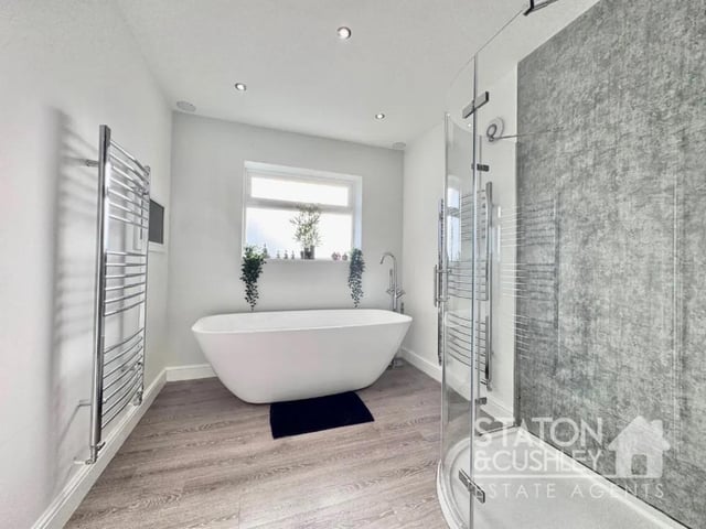 One of two bathrooms in the property featuring high end finishes.
