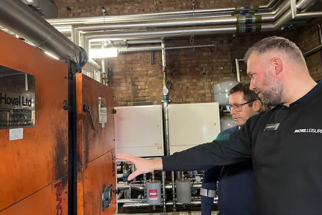 Gavin Short, right, Rebecca Adlington Leisure Centre duty manager, explains the new heating system to Andy Abrahams, Mansfield mayor.