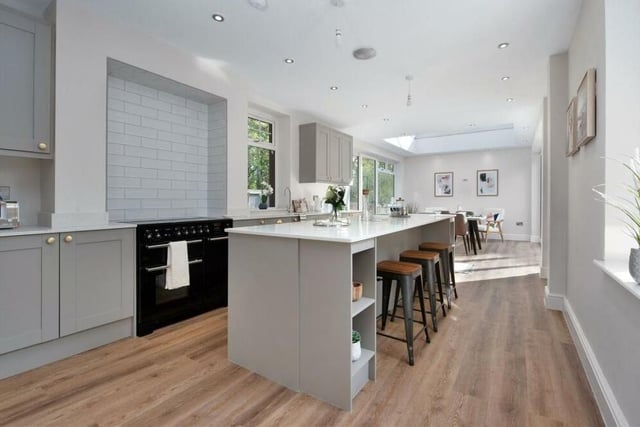 Arguably the highlight of the ground floor is this superb open-plan kitchen/diner. It includes a free-standing Rangemaster cooker with a five-ring induction hob and contemporary, tiled splashbacks behind.