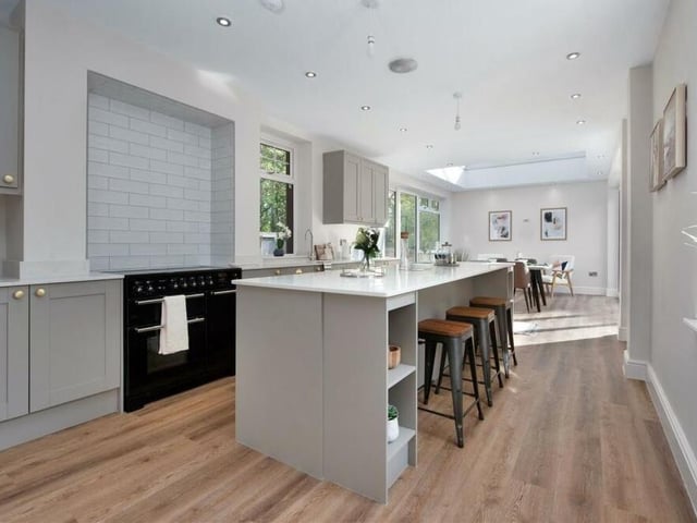 Arguably the highlight of the ground floor is this superb open-plan kitchen/diner. It includes a free-standing Rangemaster cooker with a five-ring induction hob and contemporary, tiled splashbacks behind.