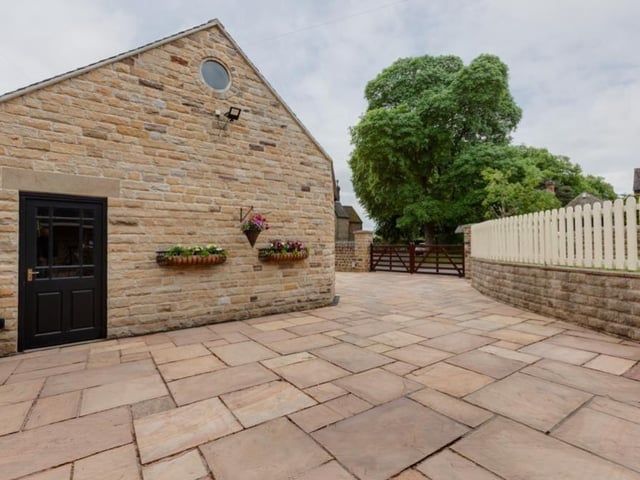 An easy-on-the-eye stone-flagged path wraps itself around much of the property