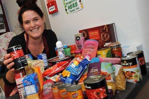 Emma Olden with food bank donations