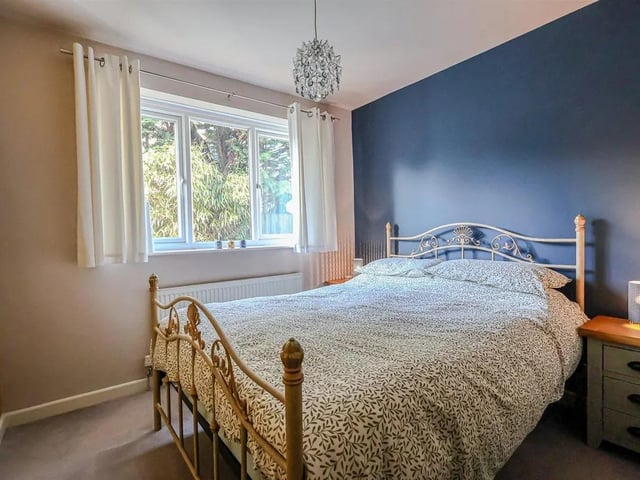 One of the light filled bedrooms in the home.