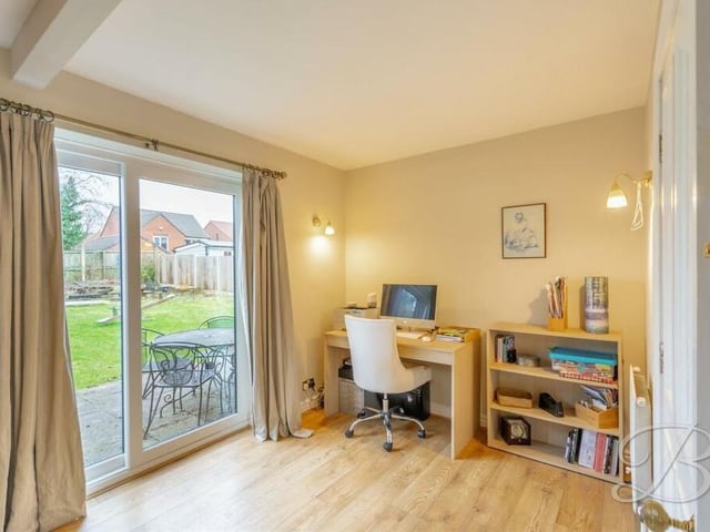 And here is a close-up of that open-plan office space, with doors leading to the garden.