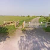 A gate with fly-tipping notices on Norman Road, Somercotes. (Photo by: Google Maps)