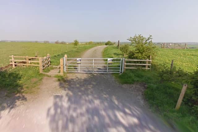 A gate with fly-tipping notices on Norman Road, Somercotes. (Photo by: Google Maps)