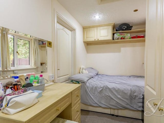 The annexe also includes this bedroom, which is compact but has enough space for a fitted wardrobe and storage. The window faces the back of the house.