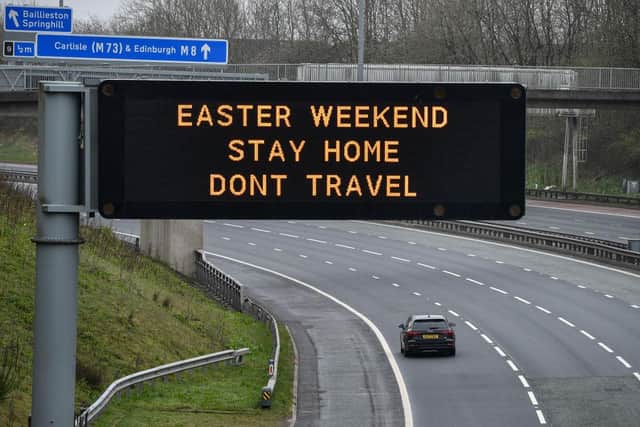 An overhead sign on the M8 advises people not to travel this Easter Weekend (Photo: Jeff J Mitchell/Getty Images)
