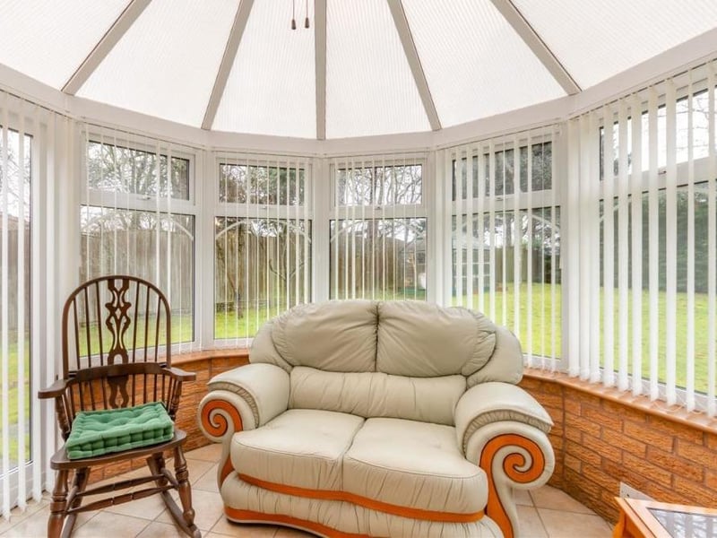 Relax in this bright conservatory, with its dome-like roof, tiled floor, TV point, ceiling fan and French doors leading out to the back garden.