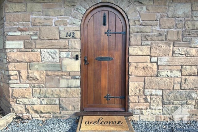 'Welcome!' is the message as we knock on the distinctive, arch feature front door.