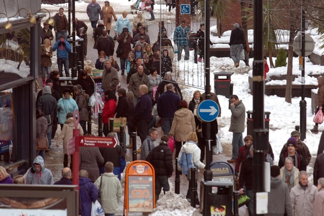 Christmas shoppers brave the inclement weather and dodged the snow piles in Barnsley town centre in 2010
