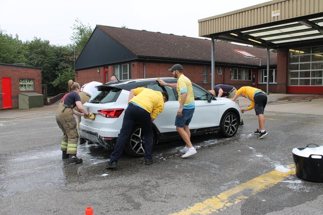 Fire crews and charity volunteers washed more than 100 cars in total at the Sutton Road station.